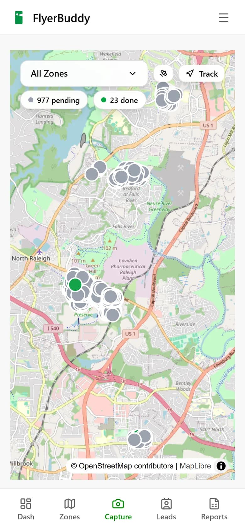The capture screen on a phone: a map with nearby property pins and controls for photographing a delivery.